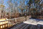 Deck overlooks the private wooded backyard 